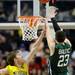 Michigan sophomore Evan Smotrycz attempts to block Ohio University junior Ivo Baltic's shot in the first half of the second round of the NCAA tournament at Bridgestone Arena in Nashville, Tenn.  Melanie Maxwell I AnnArbor.com